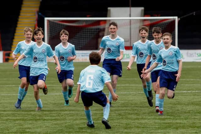 Kerse celebrate Luis Vieira's goal to win the cup. Pic Scott Loudon