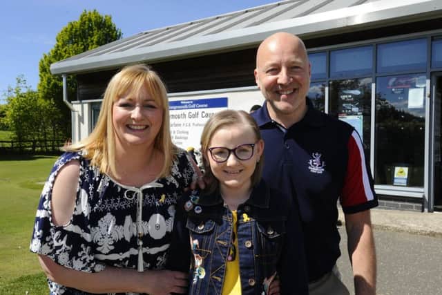 Ashlee Easton with mum Lisa and David Moncur who organised the golf day