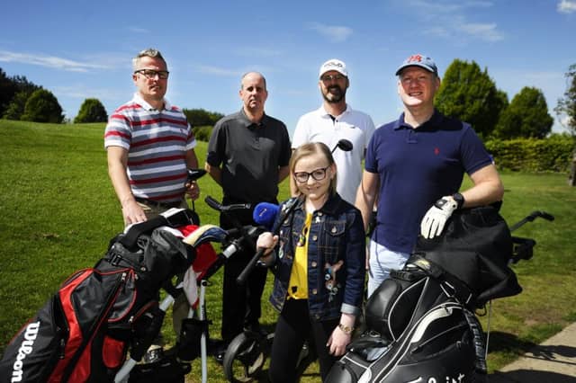 Ashlee Easton with dad Donald, far right, and golfers