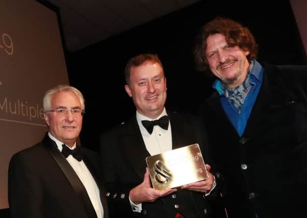 Aldi's group buying chief Graham Nicolson (in kilt) with, left, Steve Back from award sponsor Palletforce and, right, top TV chef and author Jay Rayner.