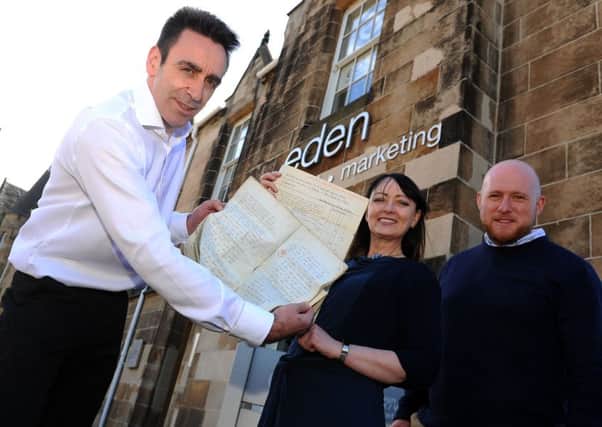Eden Design managing director Douglas Cameron, with a small sample of the treasure trove of historic documents that show the building at 4 Hope Street is much older than previously thought.