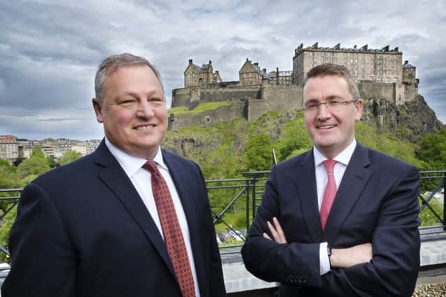 Alexander Dennis Ltd chief executive Colin Robertson (right) and Paul Soubry, NFI president and CEO. Photograph: Mike Wilkinson