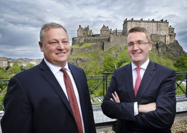 Alexander Dennis Ltd chief executive Colin Robertson (right) and Paul Soubry, NFI president and CEO. Photograph: Mike Wilkinson