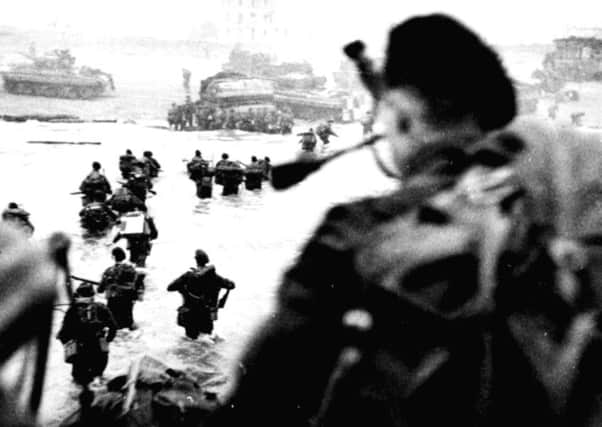 Troops storming the beachhead in 1944