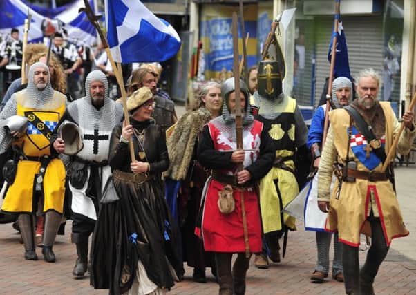 The 1298 commemoration march proceeds along Falkirk High Street, but also features special events and games for children.