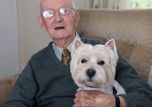 Walter at home with Harry, his beloved Westie - who is now a sprightly 14.