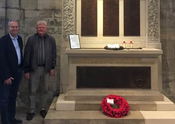 Fitting tribute...Brian Lightbody and Jim Rae at the now fully restored war memorial in St Michael's Parish Church.