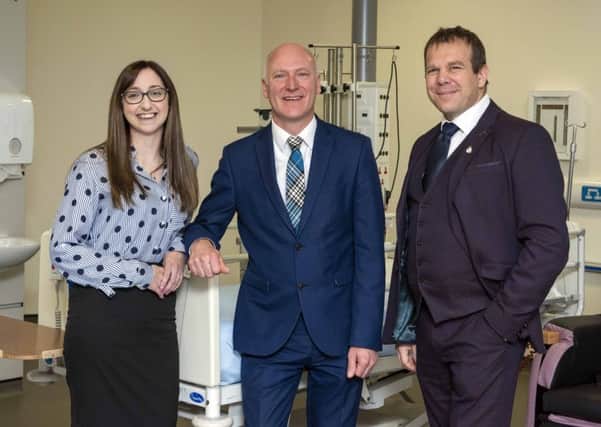 Just hours before the Bill was passed, Public Health Minister Joe FitzPatrick met two organ recipients at the Royal Infirmary of Edinburgh, Clare Blake and Jamie McGregor. (Pic: Gareth Easton)