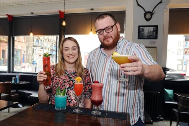 Claire Macdonald, Starthcarron Hospice's business development fundraiser, and Richard Hoehle, general manager of High Spirits, promote the launch of the bar's summer cocktail menu