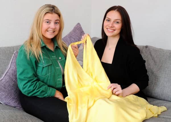 Aimee Grant, left, and Gail Wilson with the dress that saved the day on prom night
