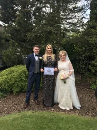 Falkirk humanist celebrant Melanie Leckie with her 500th wedding couple Jason Fraser and Nikki Wilson who were married on 1 June at Glenskirlie House