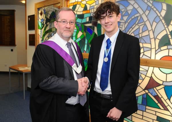 Denny High School dux Conall Grant with headteacher Stephen Miller. Picture: Michael Gillen