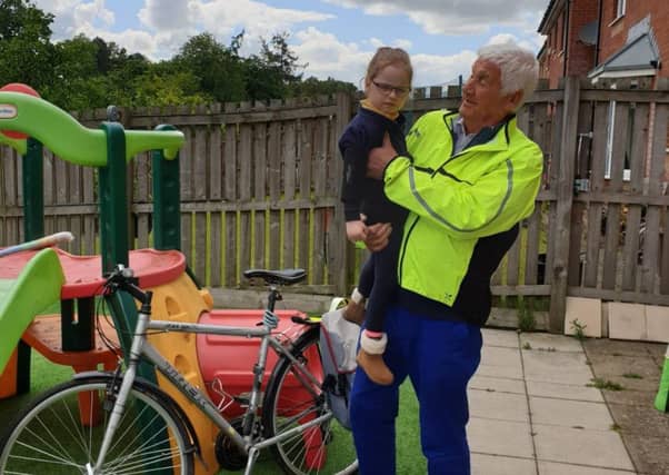 John Henderson with his granddaughter Emma