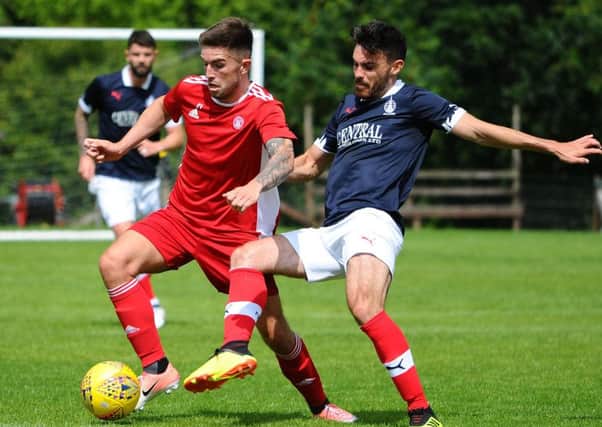 Ian McShane challenges former Falkirk player Kevin O'Hara (pic: Michael Gillen)