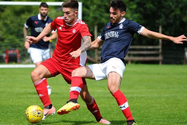 Ian McShane challenges former Falkirk player Kevin O'Hara (pic: Michael Gillen)