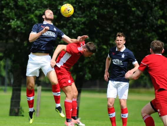 Gregor Buchanan outjumps former Bairn Kevin O'Hara during Falkirk's closed-doors friendly with Hamilton (pic: Michael Gillen)