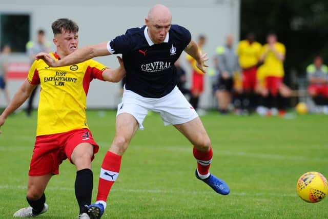 Falkirk's new signing Connor Sammon with Thistle's James Penrice (pic: Michael Gillen)