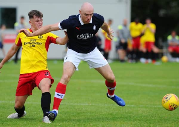 Falkirk's new signing Connor Sammon with Thistle's James Penrice (pic: Michael Gillen)