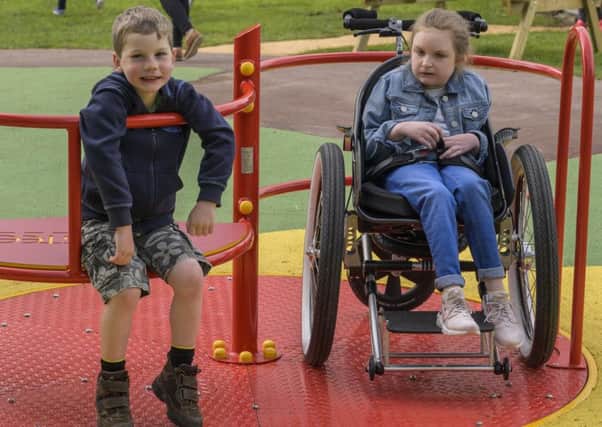 This wheelchair-accessible roundabout at a disability-friendly park in Harestanes works in a similar way to the one in Helix Park.