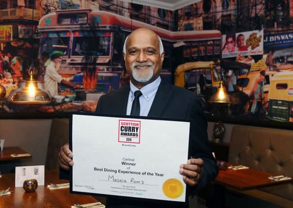 Owner Ram Salhotra with the certificate showing he won the Best Dining Experience of the Year Central in the Scottish Curry Awards 2019.
