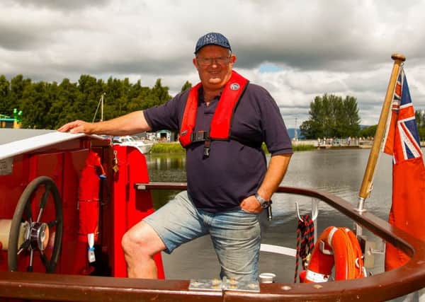 At the helm...John Sime has been a member of Seagull Trust Cruises in Falkirk for 12 years. Earlier this year, he became the Trust's chairman. (Pic: Scott Louden)