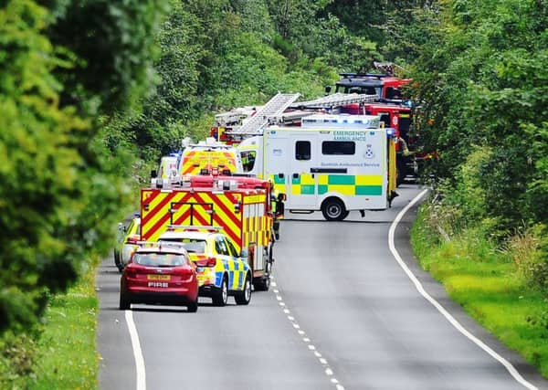 Emergency services raced to the scene on the A801. Pictures: Michael Gillen