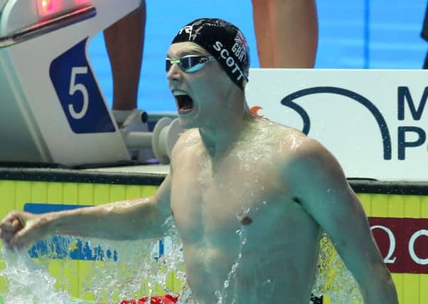 GWANGJU, SOUTH KOREA - JULY 28: Duncan Scott  celebrates winning the gold medal in the Men's 4x100m Medley Relay  (Photo by Catherine Ivill/Getty Images)
