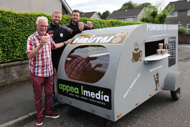Jamie Callaghan and Martin Jackson are taking part in a soapbox race to raise money for The Driving Force. They are pictured with David McMillan, chairman of The Driving Force. Picture: Michael Gillen