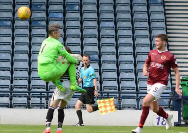 Stenhousemuir keeper Graeme Smith clatters into Kieran Moore to concede the stoppage time penalty (pic courtesy of Fraser Marr)