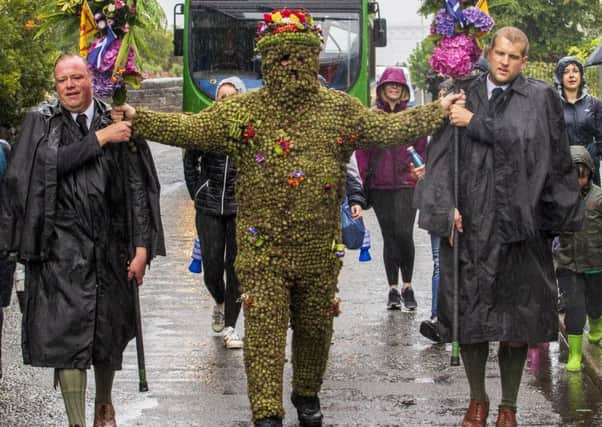 The weather is grim - but nothing stops the Burryman.