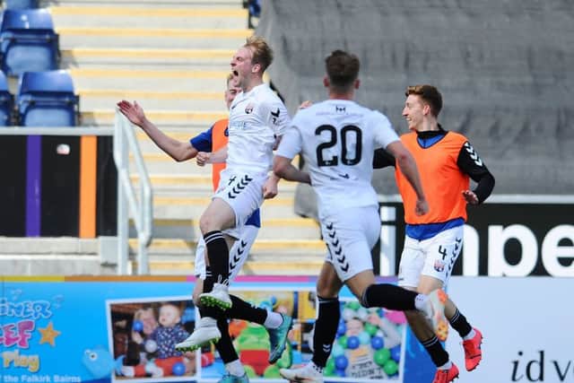 Skelly celebrates with team-mates and fans in the corner after opening the scoring for the Gable Endies