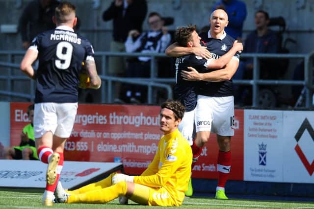 Sammon celebrates with team-mates after finding leveller