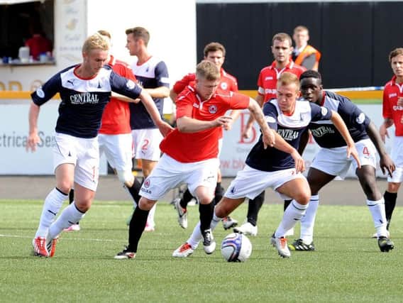 Falkirk's Craig Sibbald and Kyle Turnbull close in on Clyde's Gavin Brown during the sides' last meeting in 2013.