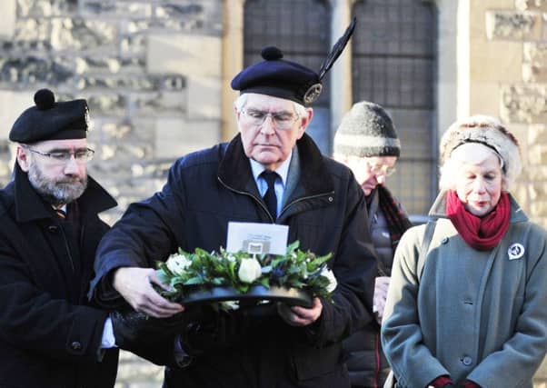 Ranald MacDonnell, current chieftain of the MacDonnells of Glengarry, prepares to lay a wreath at the Trinity Church tomb of his ancestor. The ceremony took place in January last year, and a plaque was installed to inform visitors of the terrible historic events which once happened in and around Falkirk.