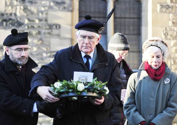 Ranald MacDonnell, current chieftain of the MacDonnells of Glengarry, prepares to lay a wreath at the Trinity Church tomb of his ancestor.  The ceremony took place in January last year, and a plaque was installed to inform visitors of the terrible historic events which once happened in and around Falkirk.