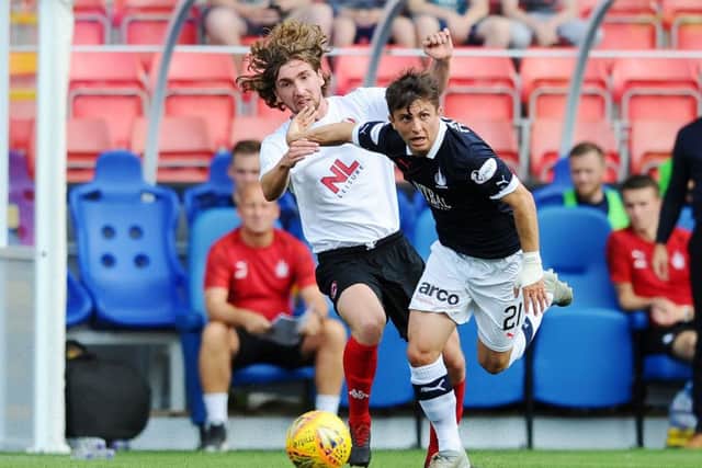 Telfer skips away from Grant. He comes close with another shot which is saved well by the impressive Mitchell.