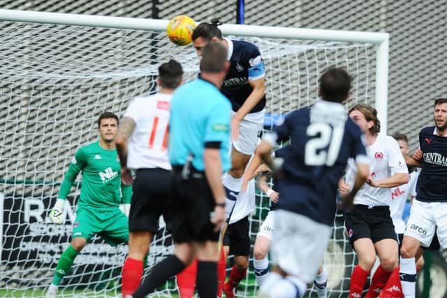 Mitchell denies Buchanan with a header (picture: Michael Gillen)