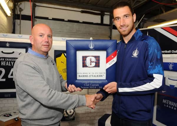 Falkirk FC captain Gregor Buchanan met with Fanatikool Ltd owner Alex Comrie at the companys new showroom in Carronshore after using its services. Pic: Michael Gillen.