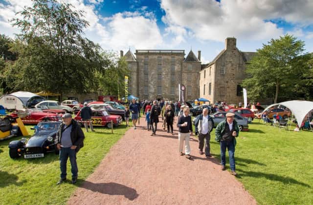 Bo'ness Revival  and Hill Climb. Spectators arrive as cars are on display in front of Kinneil House. Picture: Paul Cram.