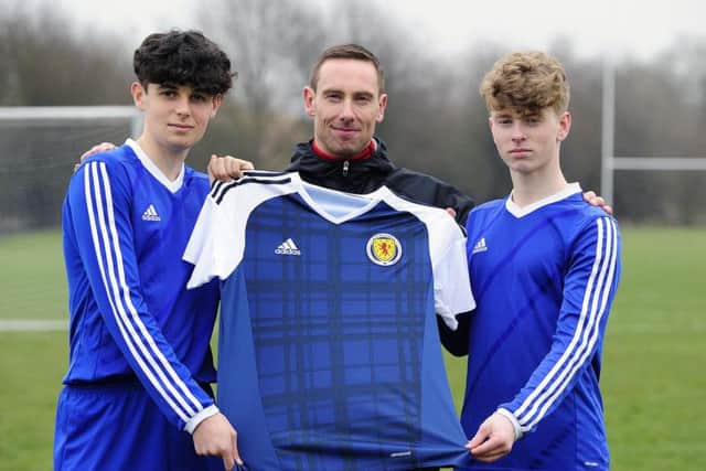Zac Butterworth (right) with Graeme High's SFA performance school chief Ian Ross and former GHS class-mate Connor McBride. Picture: Michael Gillen.