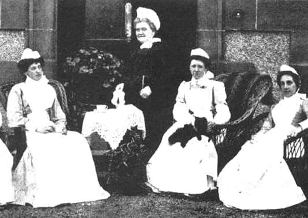 Matron Miss Joss pictured with her staff.