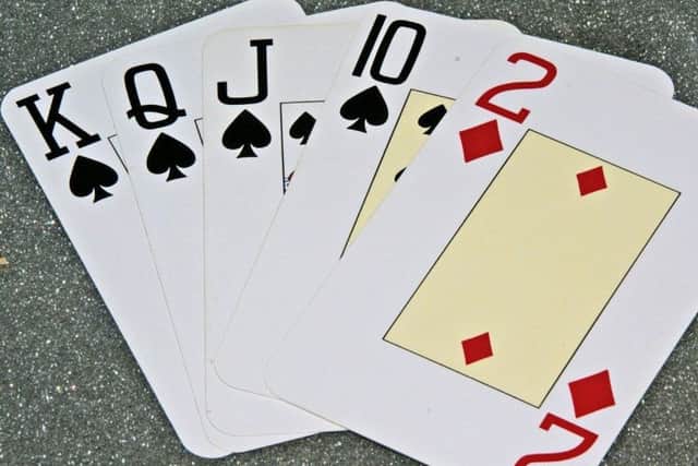 Anne is teaching people to learn to play bridge