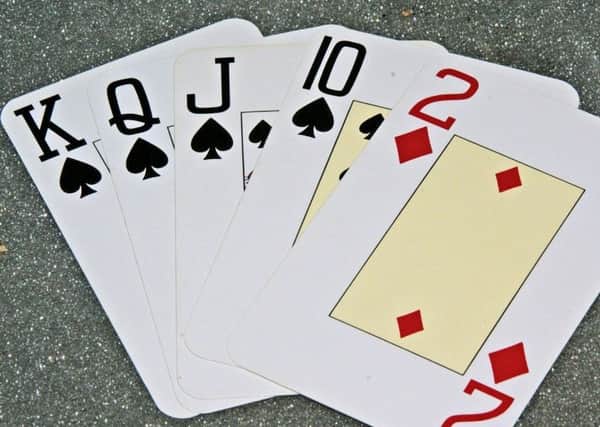 Anne is teaching people to learn to play bridge