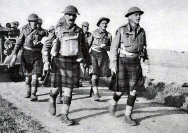 Men of the 51st Highland Division marching into a very long captivity after the surrender at St Valery.