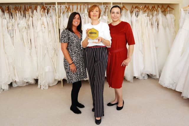 Pictured with the award are Susan Kearney, sales consultant; Fiona Smart, owner and Mariia Anaieva, bridal fitter.
Pic: Michael Gillen.