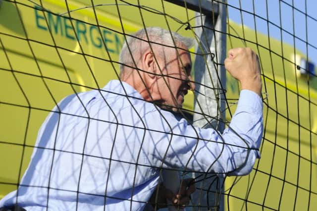 Davie Irons watched from the sidelines due to a touchline ban on Saturday. Picture: Alan Murray