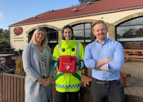 The Park Bistro and West Lothian First Responders install a new defibrillator. L to R, Bistro Manager Rachael Cook, West Lothian First Responder Nicola Scott, General Manager Colin Scott.