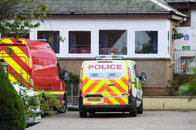 Police and fire crews were still at Blackfaulds House this morning. Picture: Michael Gillen