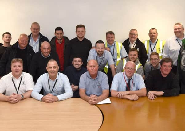 Ian McKean (front and centre), Falkirk Council's longest serving employee, was thrown a surprise presentation by his colleagues after he announced his retirement