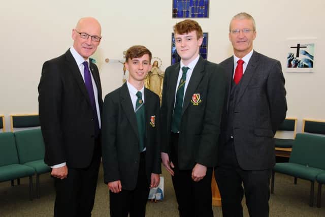 John Swinney, Deputy First Minister of Scotland; Patrick Campbell, Junior Dux; Joseph Allison, Senior Dux and Stephen Phee, Head Teacher St Mungo's High School.